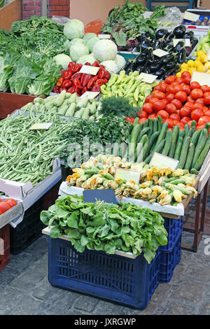 Fresh organic vegetables sold on small street market stall