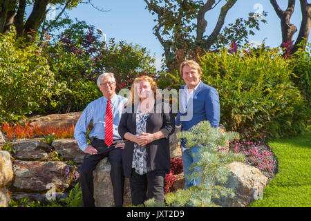 David Domoney, Charlie Dimmock, & John Craven at the Opening day at Southport Flower Show as TV presenters, garden designers, and floral experts, professional gardeners await the arrival of up to 80,000 visitors who are expected to attend to this famous annual event. Stock Photo