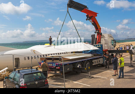 Bournemouth, Dorset, UK. 17th Aug, 2017. The UK's first aerobar is being prepared at Bournemouth beach as the 'pretend' airport takes shape. The 73ft ATR 42 aircraft is being converted into a mobile bar and the surrounding beach area transformed into airport terminal with departure lounge, duty free, club class restaurant and VIP 1st class area. 'Passengers' will be given a boarding pass on arrival. The plane will be there for 17 days and will have live entertainment. The attraction is brought to town by Poole based company Immense Events. wing Credit: Carolyn Jenkins/Alamy Live News Stock Photo