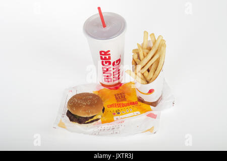 Burger King double cheeseburger with large french fries and drink with straw on wrapper. USA Stock Photo