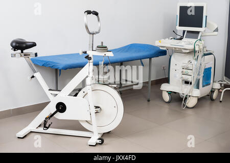 Ultrasound Machine With Examination Bed And Exercise Bike Stock Photo