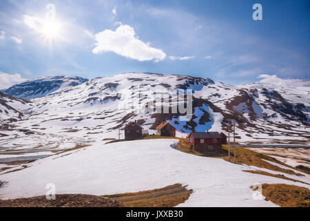 Norway with colorful wooden houses against waterfalls during spring time. Railroad from Flam to Myrdal in Norway Stock Photo