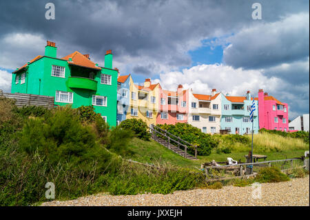 'The Headlands' apartment block terrace, 1920s, in Arts and crafts style, painted in primary colours, Thorpeness beach, Suffolk, England Stock Photo