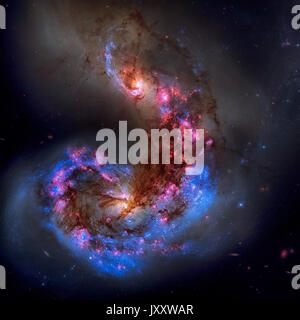 The Antennae Galaxies or NGC 4038 or NGC 4039 are undergoing a galactic collision. Located in the constellation Corvus. Retouched image. Elements of t Stock Photo