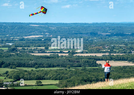 Flying kites on the South Downs near Brighton Stock Photo