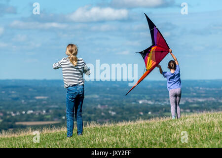 Flying kites on the South Downs near Brighton Stock Photo