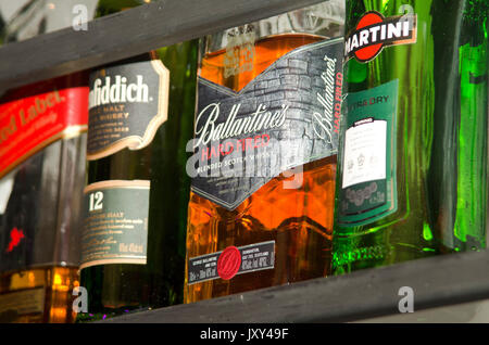 various bottles of alcohol on display in a bar Stock Photo