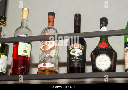 various bottles of alcohol on display in a bar