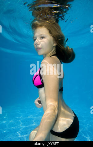Beautiful teen girl posing under water in the pool Stock ...
