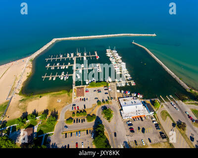 Aerial view of Lexington Michigan on Lake Huron showing a man made harbor and how it protects a marina from wind and waves Stock Photo