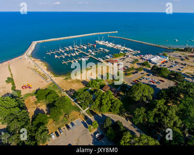 Aerial view of Lexington Michigan on Lake Huron showing a man made harbor and how it protects a marina from wind and waves Stock Photo