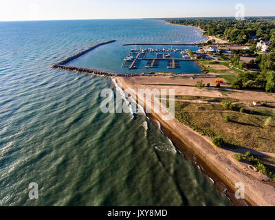 Aerial view of Lexington Michigan on Lake Huron showing a man made harbor and how it protects a marina from wind and waves Stock Photo