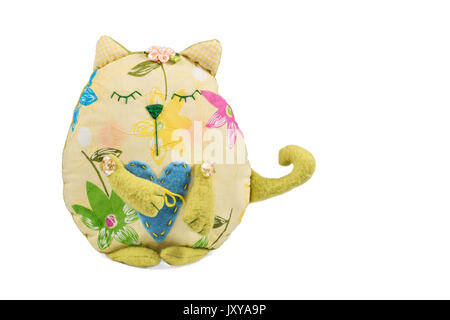 Gift toy - decorative round cat made from fabric embroidered with heart isolated on white background Stock Photo