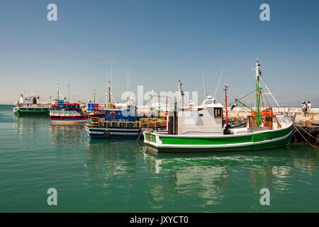 Fishing boats in Kalk Bay harbour on Cape Town's Indian Ocean coast. Stock Photo