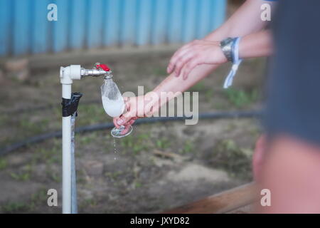 Washing Wine Glass at Wine Festival Outdoor Tap Stock Photo