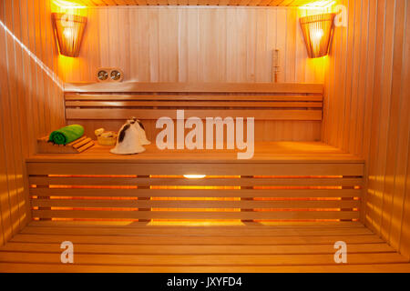 Sauna room with traditional sauna accessories Stock Photo