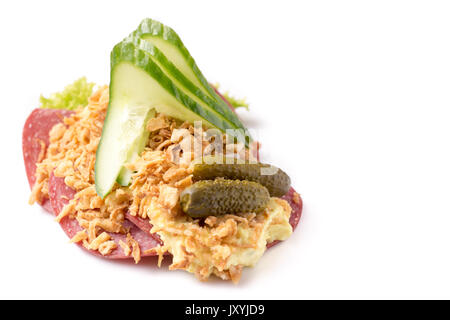 Danish specialties and national dishes, high-quality open sandwich, Salami with crispy fried onion, remoulade and cucumber isolated on white backgroun Stock Photo