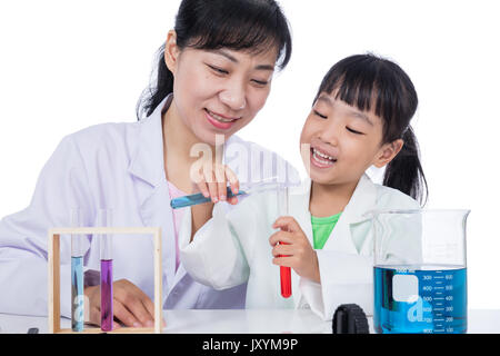 Asian Chinese teacher and little student girl working with test tube in isolated white background Stock Photo