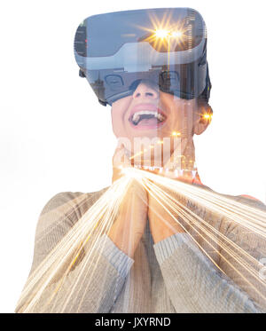 Caucasian woman wearing virtual reality goggles Stock Photo