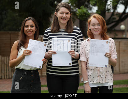 PLEASE NOTE CONFIDENTIAL DETAIL IN PHOTO PIXELATED BY PHOTOGRAPHER : Students (left to right) Georgia Sklinidjis (who received 3 A's), Katie Bonner (who received 3 A*'s) and Ciara Burke (who received 3 A's) after collecting their A-level results at St Anne&Otilde;s Catholic High School for Girls in north London. Stock Photo