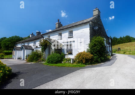 Whitewashed country cottage near Elterwater in the Langdale area of the English Lake District Stock Photo