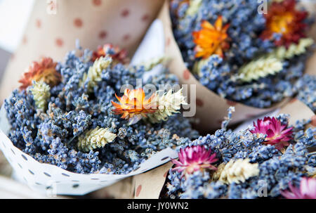 Bouquets of flowers in a basket on the market Stock Photo