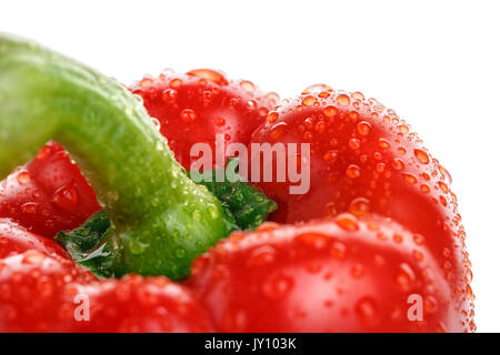 Ripe red pepper with drops of water close. On a white background Stock Photo