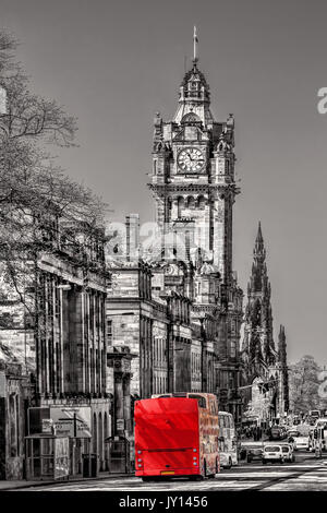 Edinburgh with red bus against clocktower in Scotland, UK Stock Photo