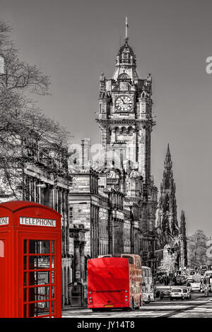 Edinburgh with phone booths and red bus against clocktower in Scotland, UK Stock Photo