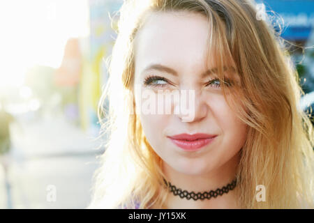 Portrait of Caucasian woman crinkling nose Stock Photo