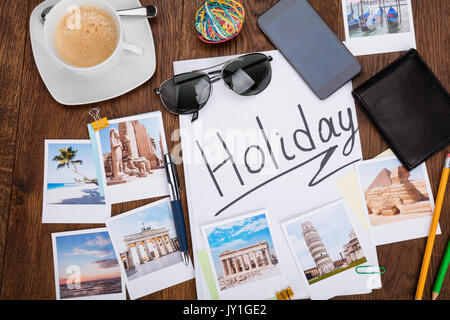 Photos Of Holiday On Wooden Desk With Sunglasses And Smartphone Stock Photo