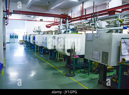 Workshop area with a row of CNC machines