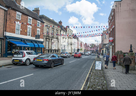 Bunting hanging over Church street in Ashbourne Derbyshire, England, UK, Europe Stock Photo