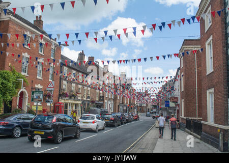 Bunting hanging over Church street in Ashbourne Derbyshire, England, UK, Europe Stock Photo