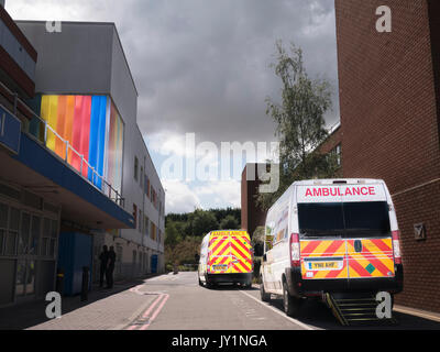 Ambulances parked outside the main entrance of the NHS general hospital, Kettering, England. Stock Photo
