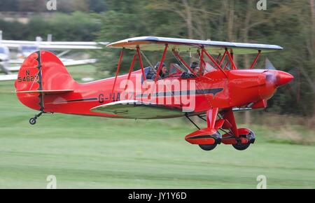 Hatz CB-1 biplane taking off from Old Warden Aerodrome Stock Photo