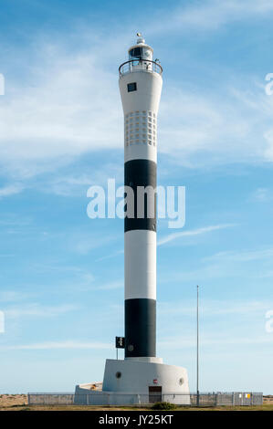 The automatic black and white striped New Lighthouse at Dungeness in Kent. Stock Photo
