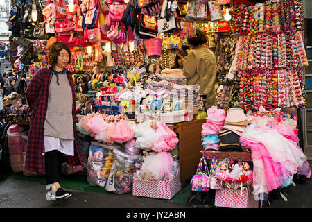 Seoul, Korea - April 04, 2017: Woman in front of the souvenir shop in Namdaemun market. Namdaemun market is a large traditional market in Seoul, South Stock Photo