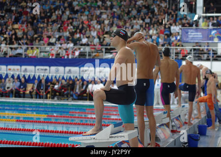 St. Petersburg, Russia - December 16, 2016: Men on the start of 100 m freestyle swimming during X Vladimir Salnikov Cup. Athletes from 6 countries par Stock Photo