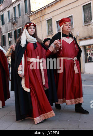 Venice,Italy,February 26th 2011: A medieval couple marching in a costume parade in Venice during The Carnival days.The Carnival of Venice (Carnevale d Stock Photo