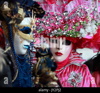 Venice,Italy,February 26th 2011:Close up image of colourful masks during the Canival of Venice.Selective focus on the eyes of the red mask.The Carniva Stock Photo