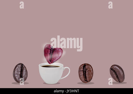 A cup of coffee beans and pink heart coffee bean floats over the glass with smoke isolatted on pink background, Valentine and love concept. Stock Photo