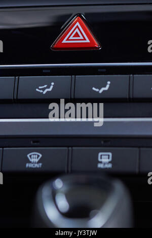 Emergency light button  in car interior. Red accident button Stock Photo