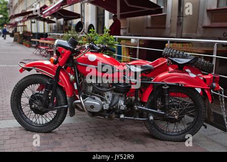 Red vintage IMZ-Ural motorbike with sidecar Stock Photo