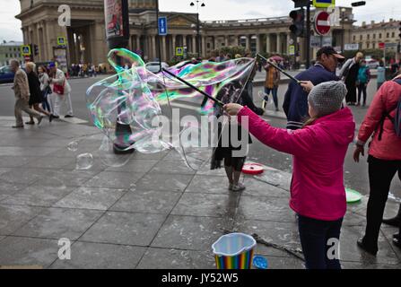 Children doing soap bubbles on Nevsky Prospect, St. Peterburg, Russia Stock Photo