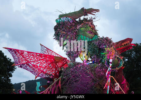 Glanusk Park, Brecon, Wales, 17th August 2017.  The start of The Green Man music festival in the Brecon Beacons Mountains in Wales. This year the giant wicker man is in the shape of a dragon. It’s the day before the music officially starts and the sell-out crowd of 20,000 have come prepared for a weekend of bad weather. Credit: Rob Watkins/Alamy Live News Stock Photo