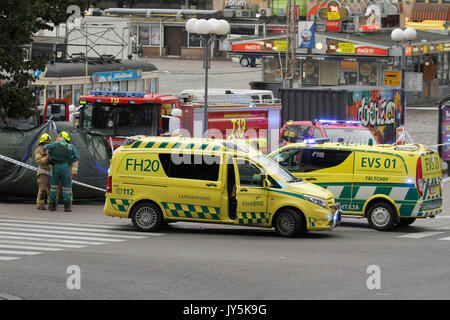 Turku, Finland. 18th August, 2017. Several people have been stabbed in Central Market Square of Turku and Puutori Market Square nearby this location. At least one person has been killed at the Central Market Square and is supposedly behind green tarp. Several other have been wounded. Police has secluded area. Credit: Jukka Palm/Alamy Live News Stock Photo