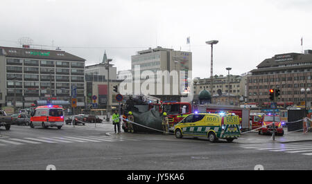 Turku, Finland. 18th August, 2017. Several people have been stabbed in Central Market Square of Turku and Puutori Market Square nearby this location. At least one person has been killed at the Central Market Square and is supposedly behind green tarp. Several other have been wounded. Police has secluded area. Credit: Jukka Palm/Alamy Live News Stock Photo