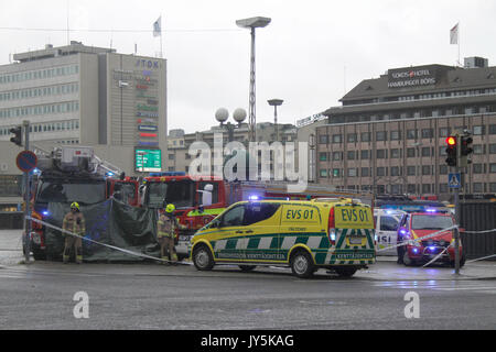 Turku, Finland. 18th August, 2017. Several people have been stabbed in Central Market Square of Turku and Puutori Market Square nearby this location. At least one person has been killed at the Central Market Square and is supposedly behind green tarp. Several other have been wounded. Police has secluded area. Credit: Jukka Palm/Alamy Live News Stock Photo