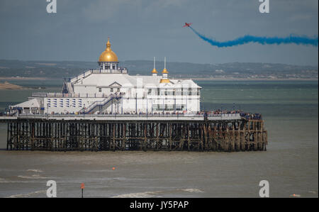 Eastbourne, England, UK. 18th August 2017. Day 2 of Airbourne, the popular south coast seaside airshow on its 25th anniversary. A solo display aircraft of The Red Arrows RAF aerobatic team passes Eastbourne pier Credit: Malcolm Park / Alamy Live News Stock Photo